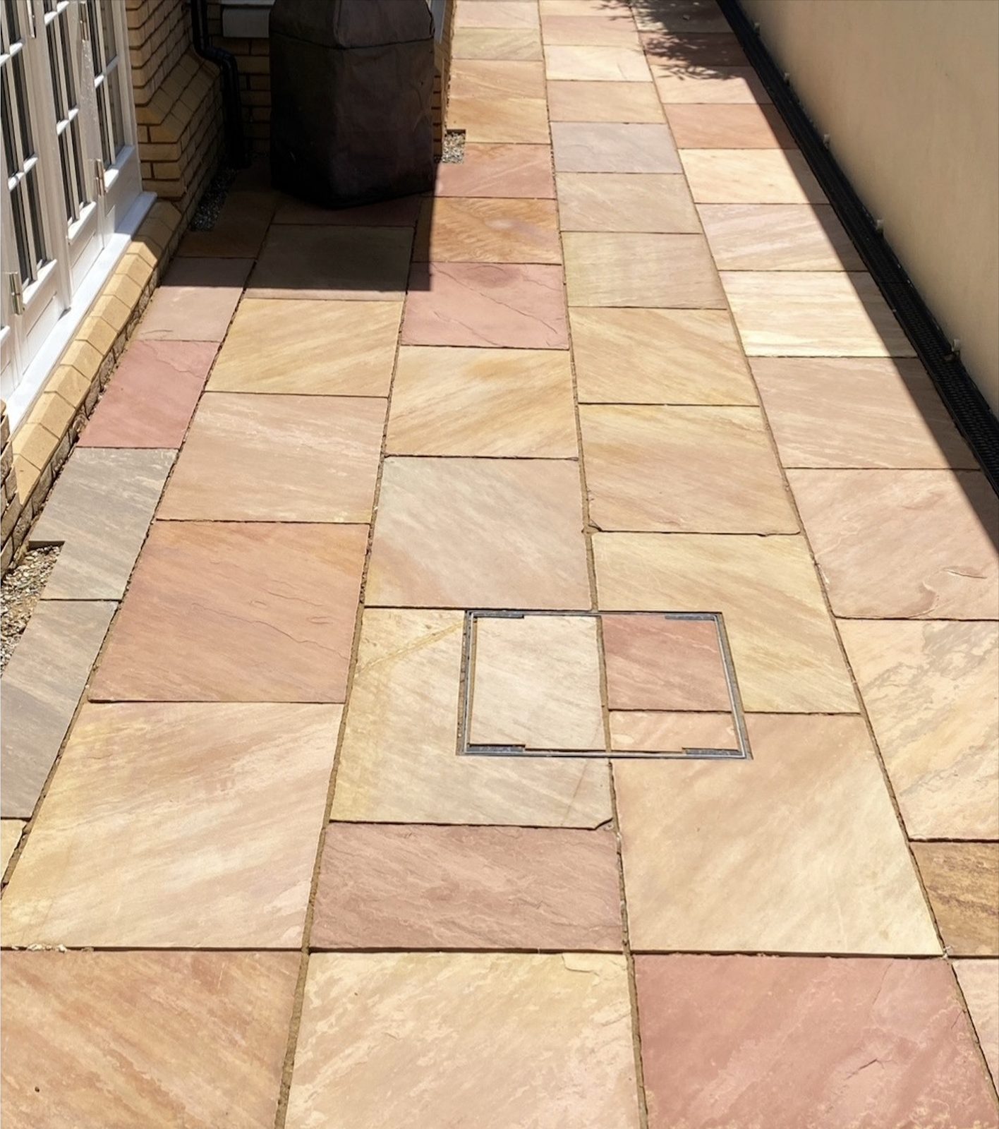 Clean driveway and home exterior after Apex Power Wash cleaning